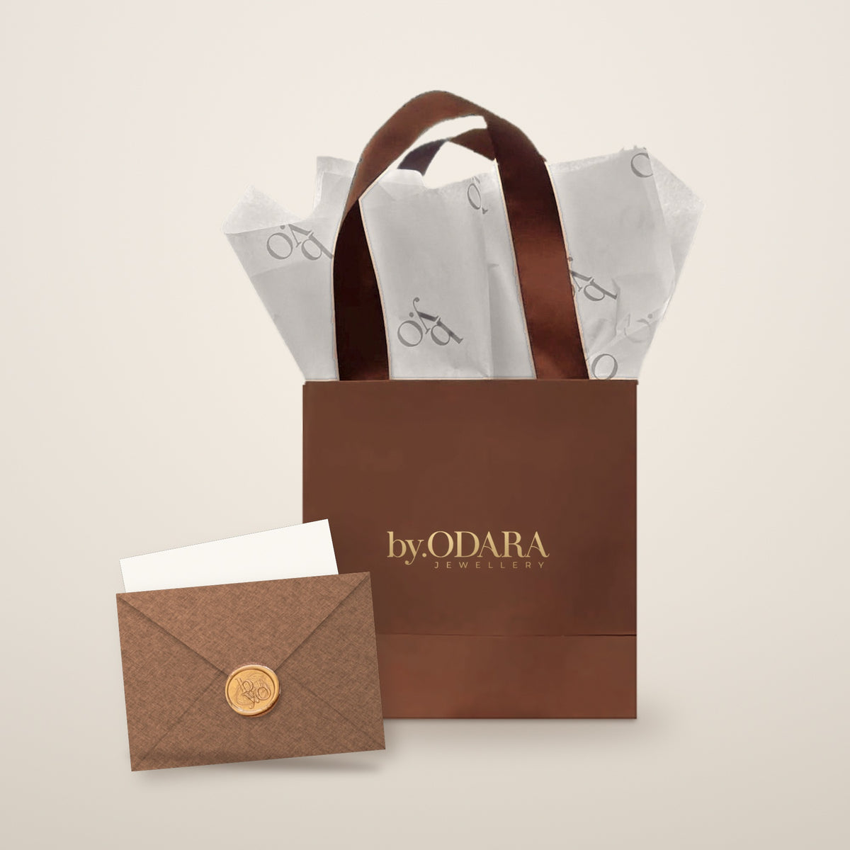 By Odara Gift Bag Kit: brown gift bag with satin handles, monogram tissue paper and sealed envelope with blank card